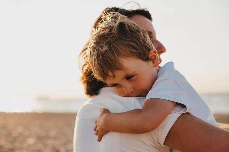 Mother hugging child with special needs